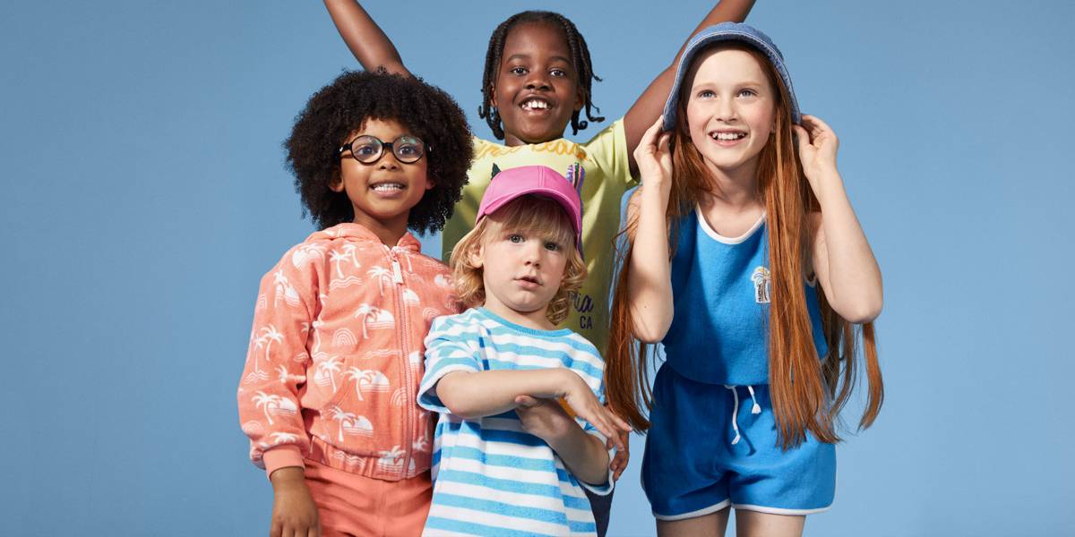 Several kids wearing new-season clothing. Shop new in